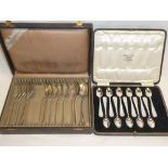 A part set of eight French silver dessert spoons and seven matching forks in lined case and a part