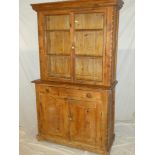 An old polished pine kitchen dresser, possibly Cornish,