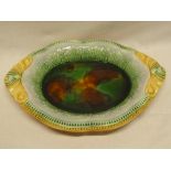 A good quality majolica glazed oval serving bowl with green, brown and yellow glazed decoration,