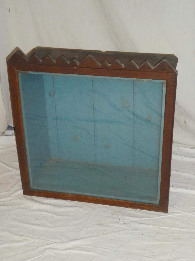 An old stained wood rectangular glazed display case,