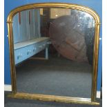 An old arched over mantel mirror in painted gilt frame,