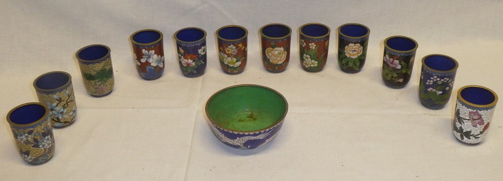 A set of twelve Chinese cloisonne enamelled beakers with floral decoration and a similar Chinese