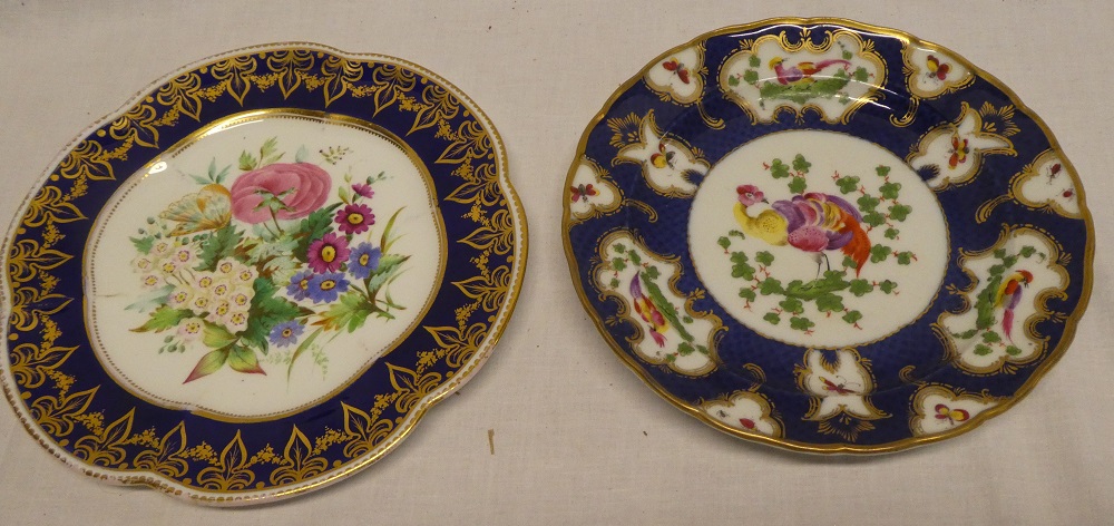 An early 19th Century china circular plate with painted bird and floral decoration within blue