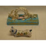 A good quality Continental porcelain table centre in the form of a dragon on rectangular base (af)