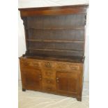 A George III oak dresser with three drawers in the frieze,