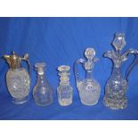 A good quality Edwardian cut-glass claret jug with silver-plated mounts and hinged lid;
