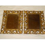 A pair of rectangular wall mirrors in gilt painted wood scroll frames 22" x 19"