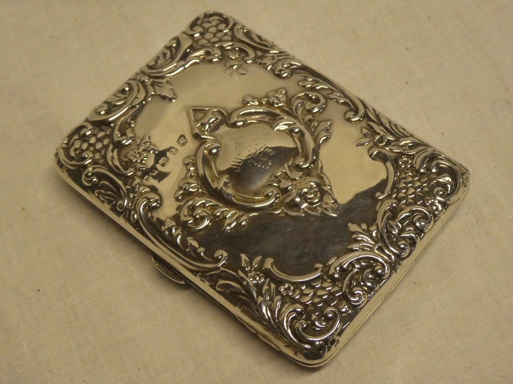 A late Victorian silver rectangular card case with leather lined interior and internal notelet,