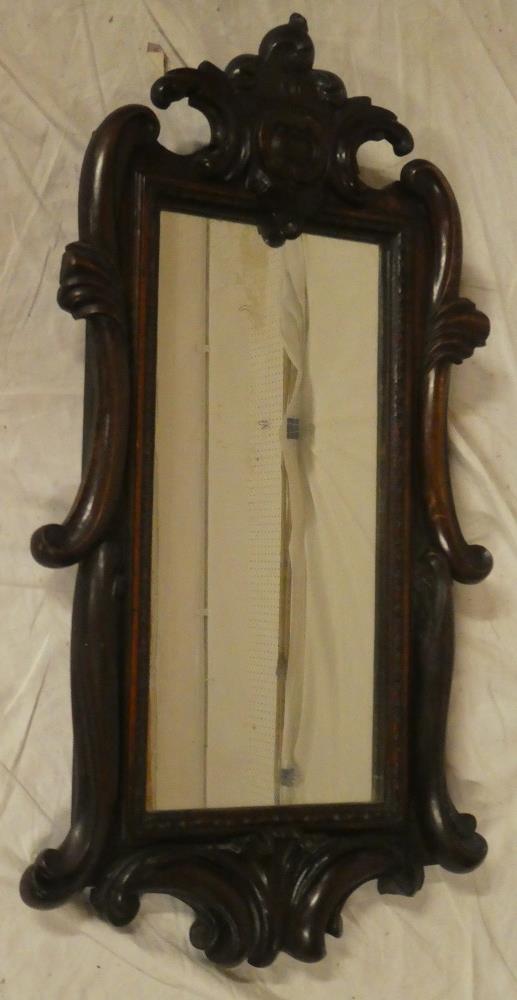 A good quality rectangular wall mirror in polished mahogany carved scroll frame,