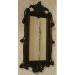 A good quality rectangular wall mirror in polished mahogany carved scroll frame,