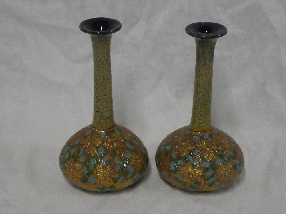 A pair of Royal Doulton pottery tapered spill vases with gilt and blue glazed decoration,