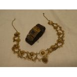 A Victorian pinchbeck mounted memoriam bracelet with inset hair panel and woven strap together with