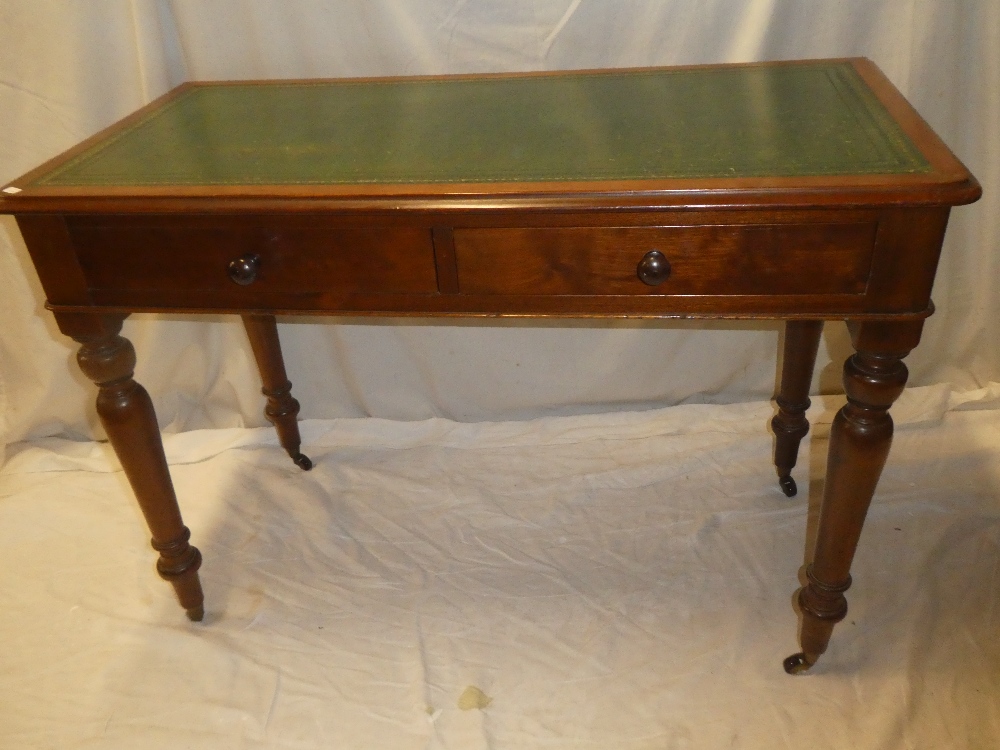 A Victorian mahogany rectangular writing table with inset leather writing surface,