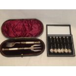 A set of six sterling silver coffee spoons with pearl decorated handles,