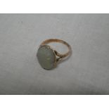 A Chinese gold dress ring set an oval opal