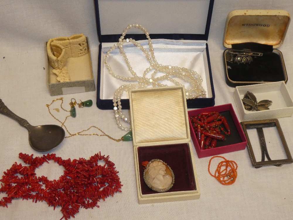 A box containing various costume jewellery including three silver Merchant Navy style brooches,