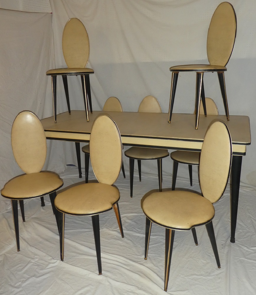 An unusual 1950's cream and black vinyl finished dining suite by Umberto Mascagni comprising a