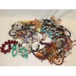 A large selection of various costume jewellery including necklaces etc.