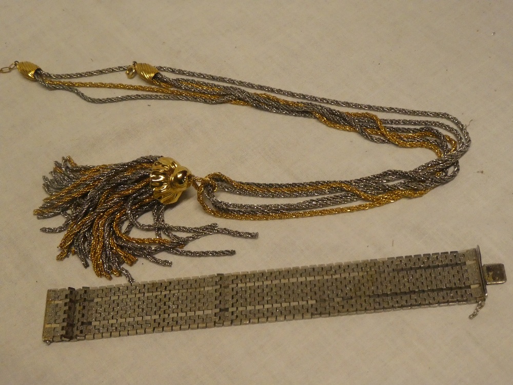 An ornate multi-strand necklace and a broad gold-plated flat link bracelet (2)