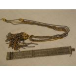 An ornate multi-strand necklace and a broad gold-plated flat link bracelet (2)