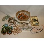 A selection of various costume jewellery including necklaces, brooches etc.