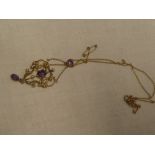 A 9ct gold mounted Art Nouveau pendant necklace set amethyst and seed pearls