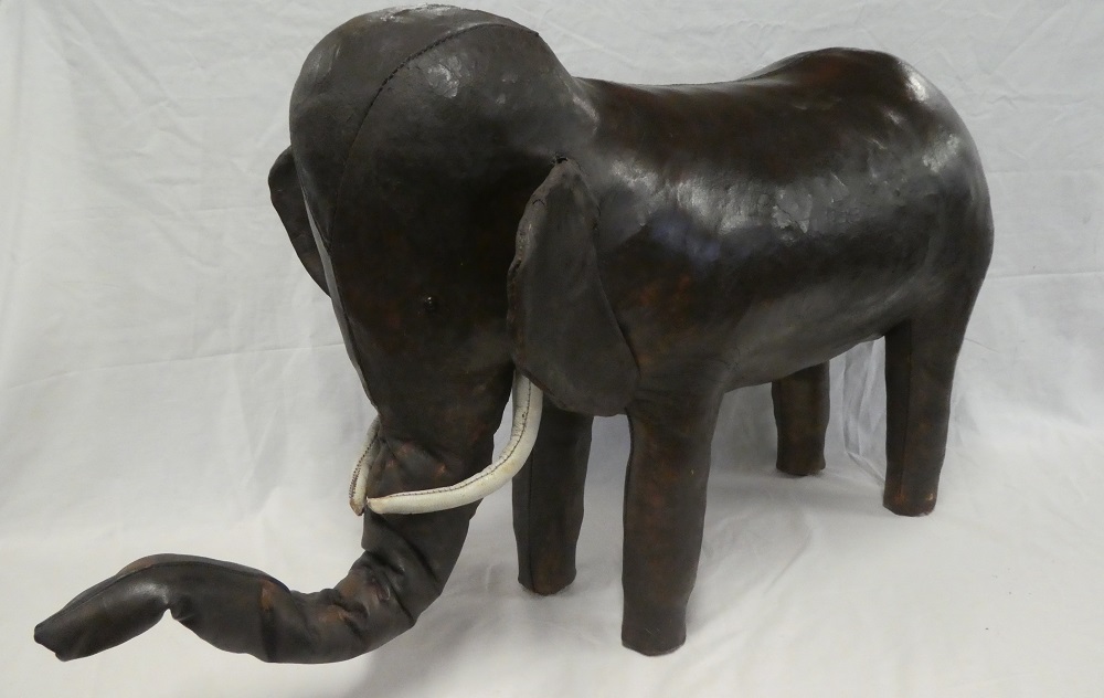 A rare Liberty & Co brown leather footstool in the form of an elephant,