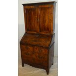 A George III mahogany cross banded bureau bookcase, the fitted interior with numerous drawers,