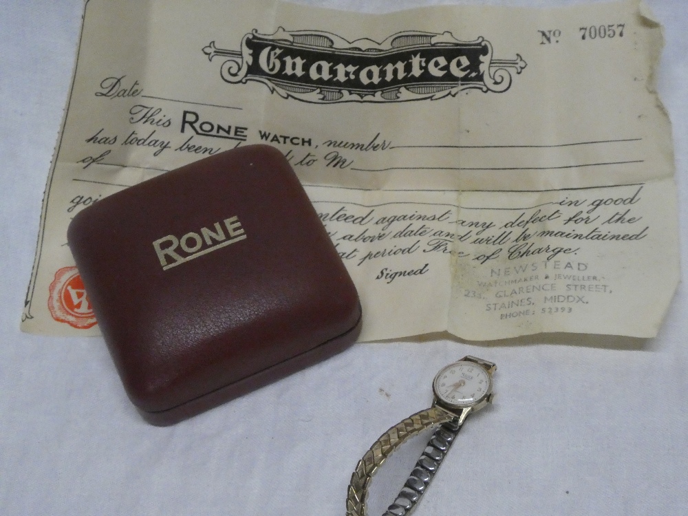 A ladies 9ct gold wristwatch by Rone with expanding strap in original maker's case with receipt