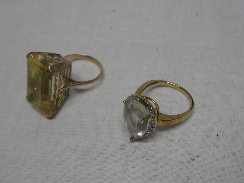 A 9ct gold dress ring with scroll mount set topaz and one other 9ct gold dress ring (2)