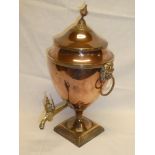 A late Victorian copper and brass mounted tapered samovar with lions mask handles on square base
