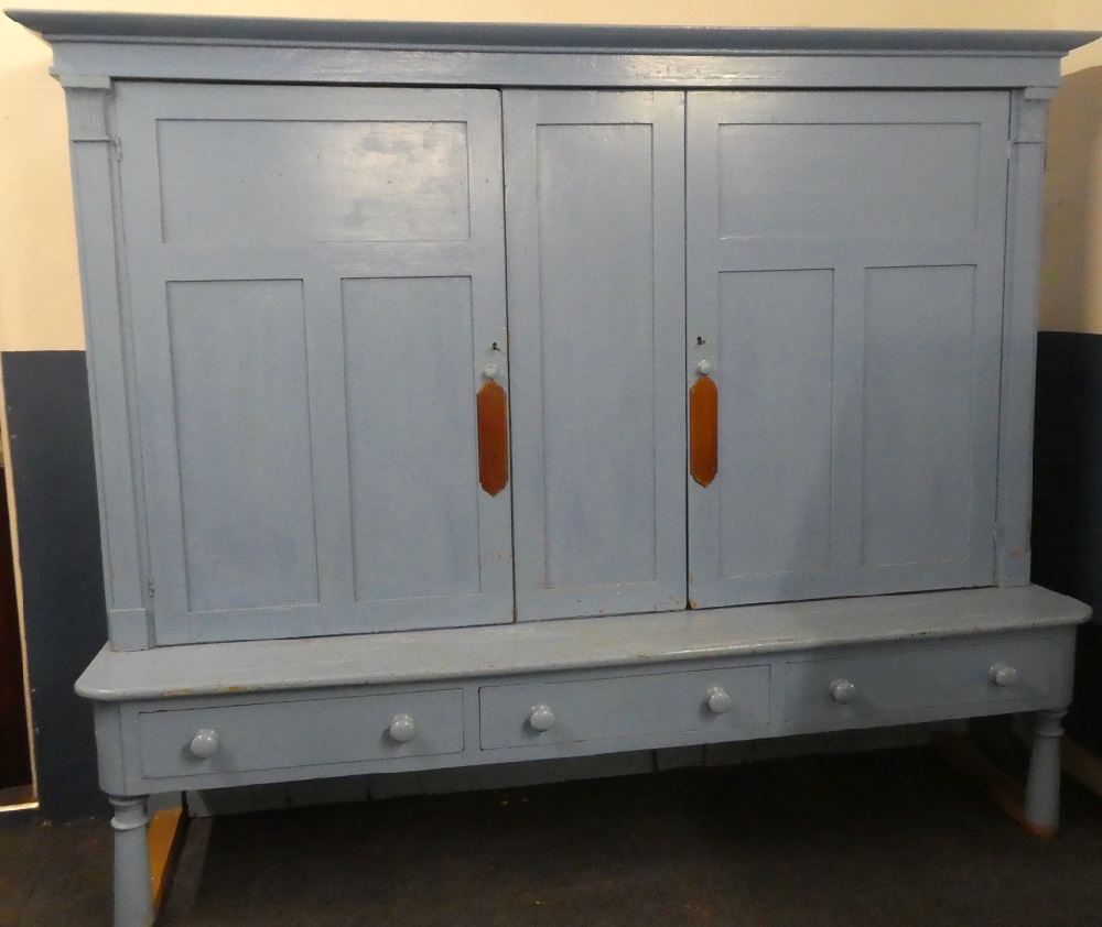 An unusual large 19th Century painted pine housekeeper's cupboard with shelves enclosed by two