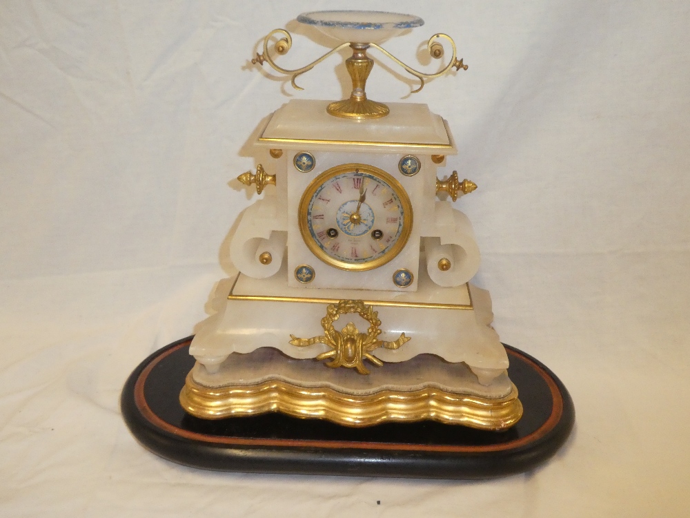 A 19th century French gilt mounted Alabaster mantel clock with circular dial in ornamental tapered