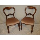 A set of four carved mahogany balloon-back dining chairs by Jarvis & Bulman Limited of Cardiff with