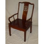 A good quality Chinese carved and polished mahogany carver armchair with bird decorated splat-back