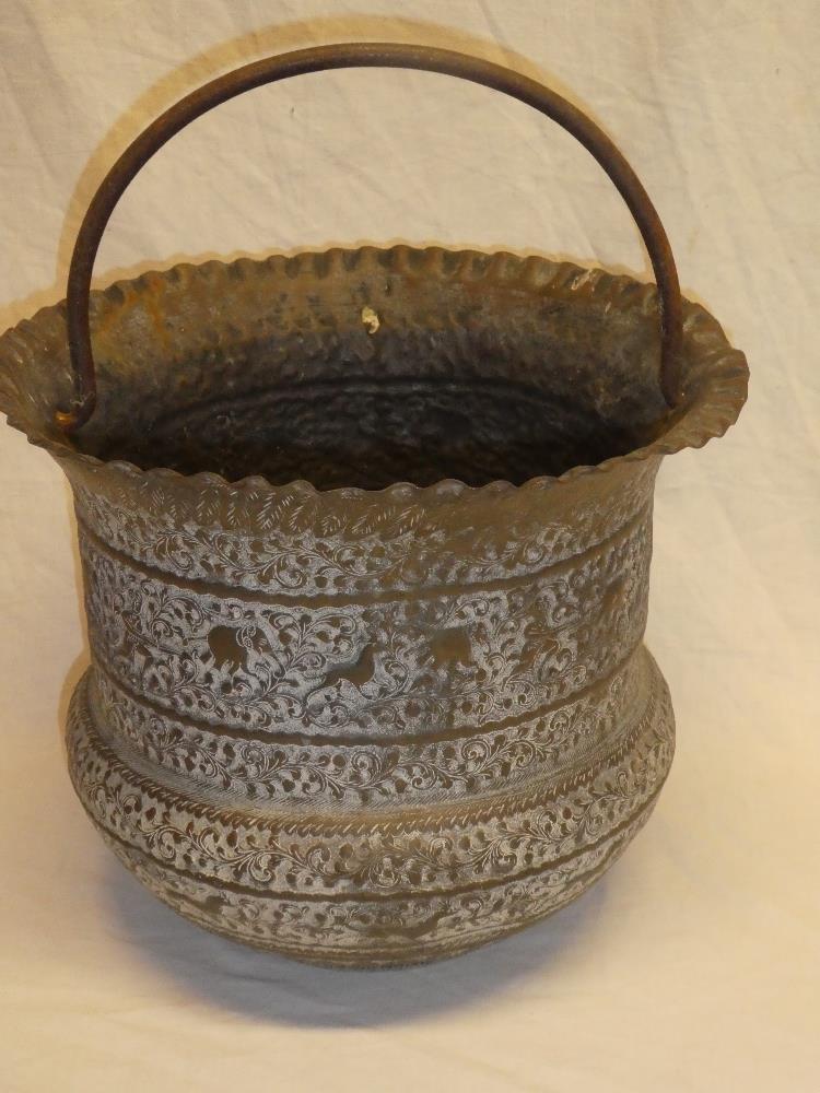 An old Indian brass circular pail/cauldron with raised figure,