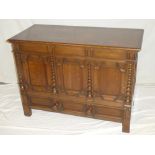 A good quality carved and polished oak rectangular mule chest with compartment enclosed by a hinged