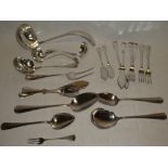A selection of French silver table cutlery including ladle, serving spoons, table forks etc.