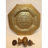 An old Indian brass octagonal tray decorated with numerous figures and elephants,