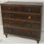 A 19th century mahogany chest of two short and three long drawers with turned handles on turned