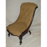 A 19th century carved rosewood easy chair upholstered in buttoned fabric on scroll shaped legs with