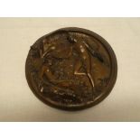 An unusual 19th Century bronze circular wall plaque decorated in relief with Adam and Eve engraved