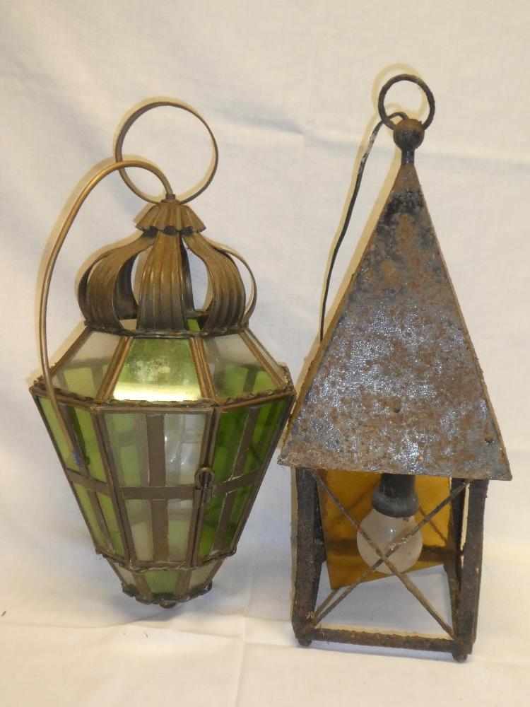 A brass octagonal ceiling light with green tinted glass panels and one other painted metal hall