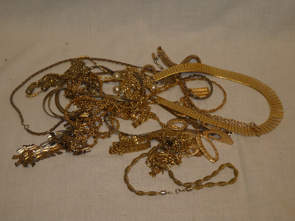 A selection of various gilt costume jewellery, necklaces, bracelets etc.
