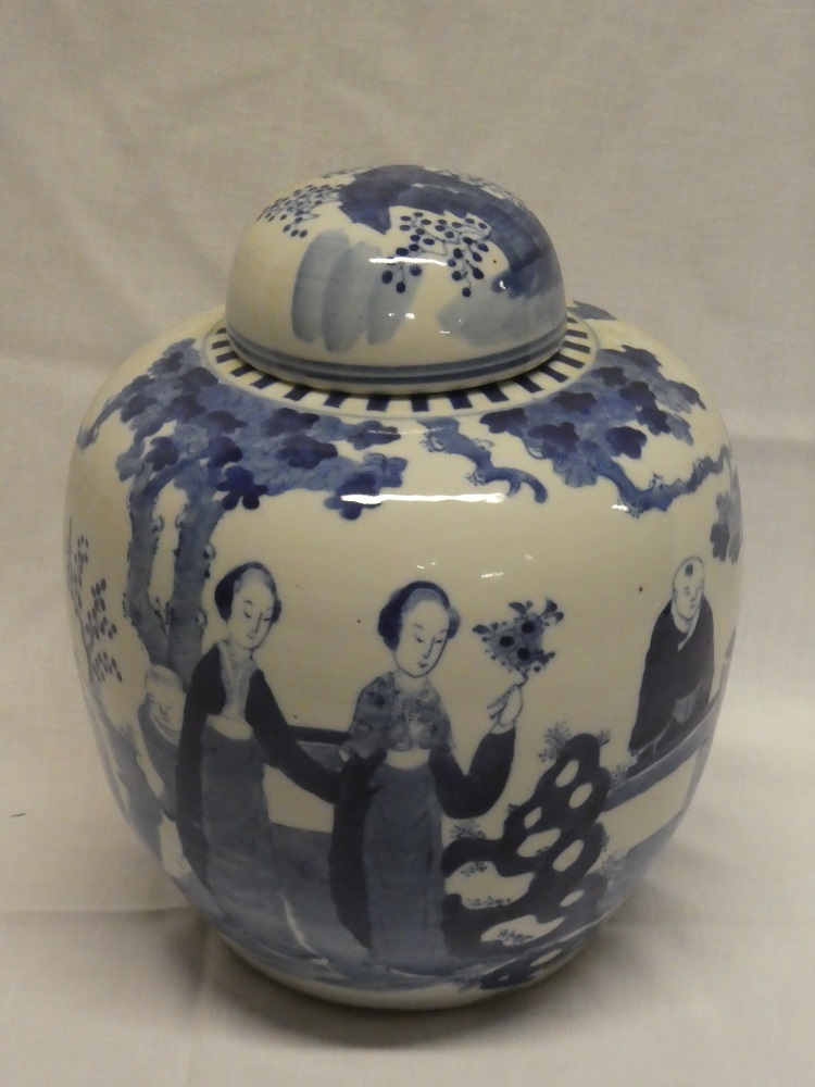 A 19th century Chinese circular gift jar and cover with blue and white painted figure and landscape