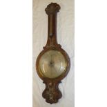 A large 19th century mercury barometer with silvered circular dial below thermometer in inlaid