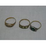 An 18ct gold dress ring with pierced mounts set five natural diamond chips and two other various