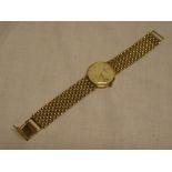 A gentlemen's 9ct gold wrist watch marked "Geneve Gold" with 9ct gold strap