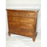 A Victorian polished mahogany chest of two short and three long drawers with turned handles on