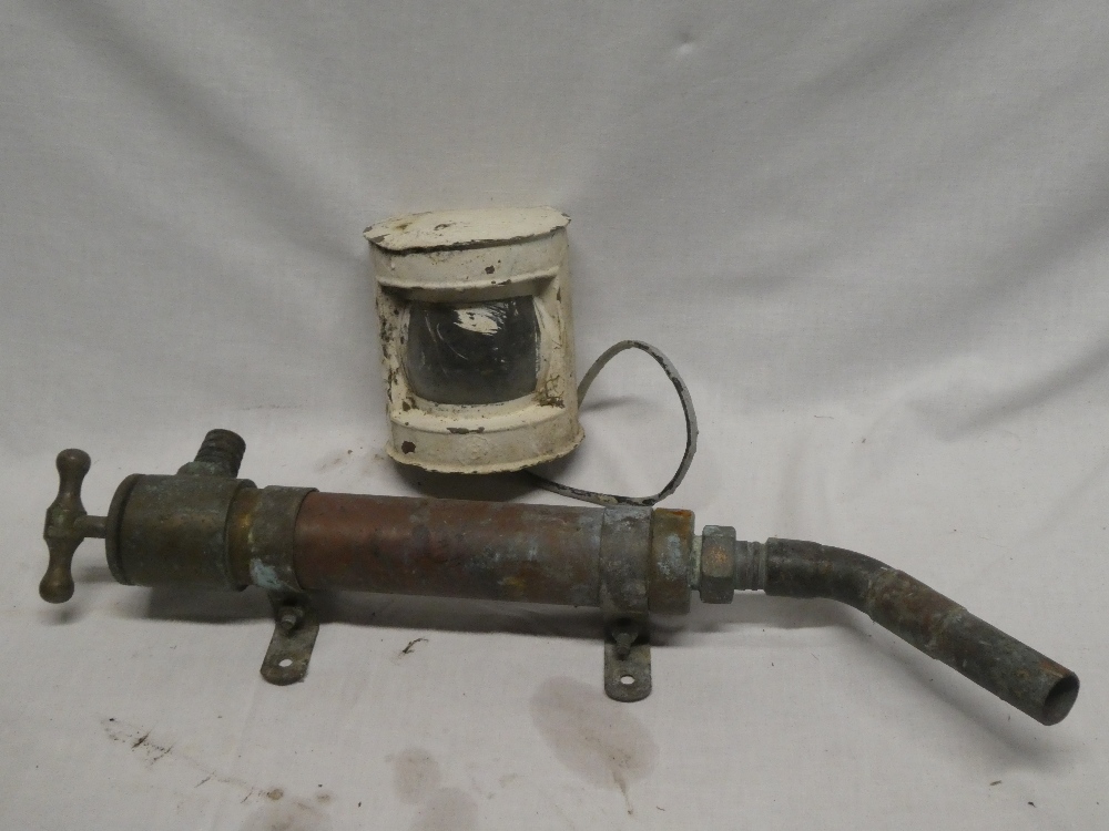 An old brass and copper nautical hand pump and a painted metal boat lamp (2)